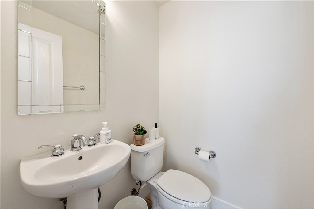 94 Chantilly Irvine, CA 92620 - Photo 12 of 30 a bathroom with a sink a toilet and mirror