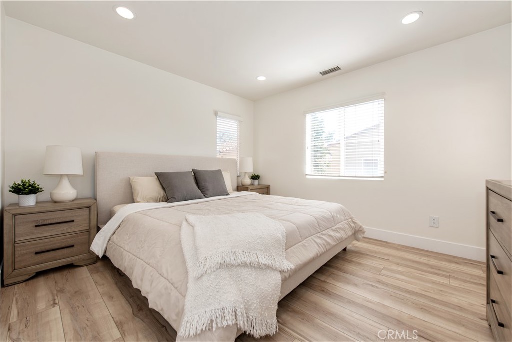 94 Chantilly Irvine, CA 92620 - Photo 13 of 30 a bedroom with a bed and a window