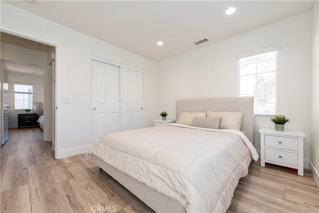 94 Chantilly Irvine, CA 92620 - Photo 19 of 30 a bedroom with a bed and a view