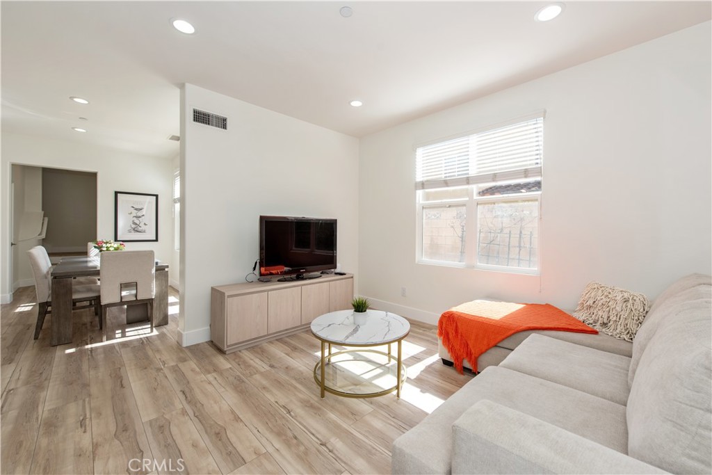 94 Chantilly Irvine, CA 92620 - Photo 2 of 30 a living room with furniture and a flat screen tv