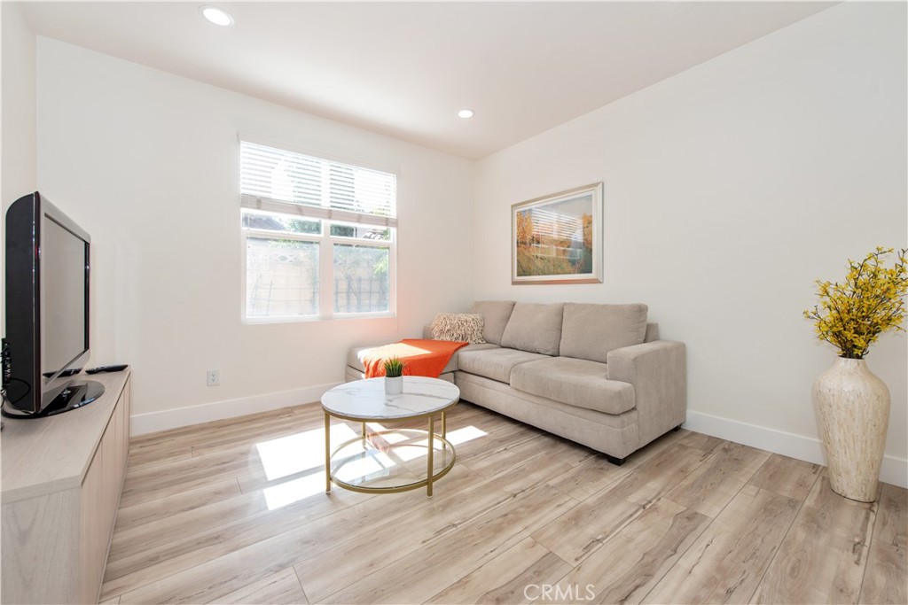 94 Chantilly Irvine, CA 92620 - Photo 4 of 30 a living room with furniture a flat screen tv and a window