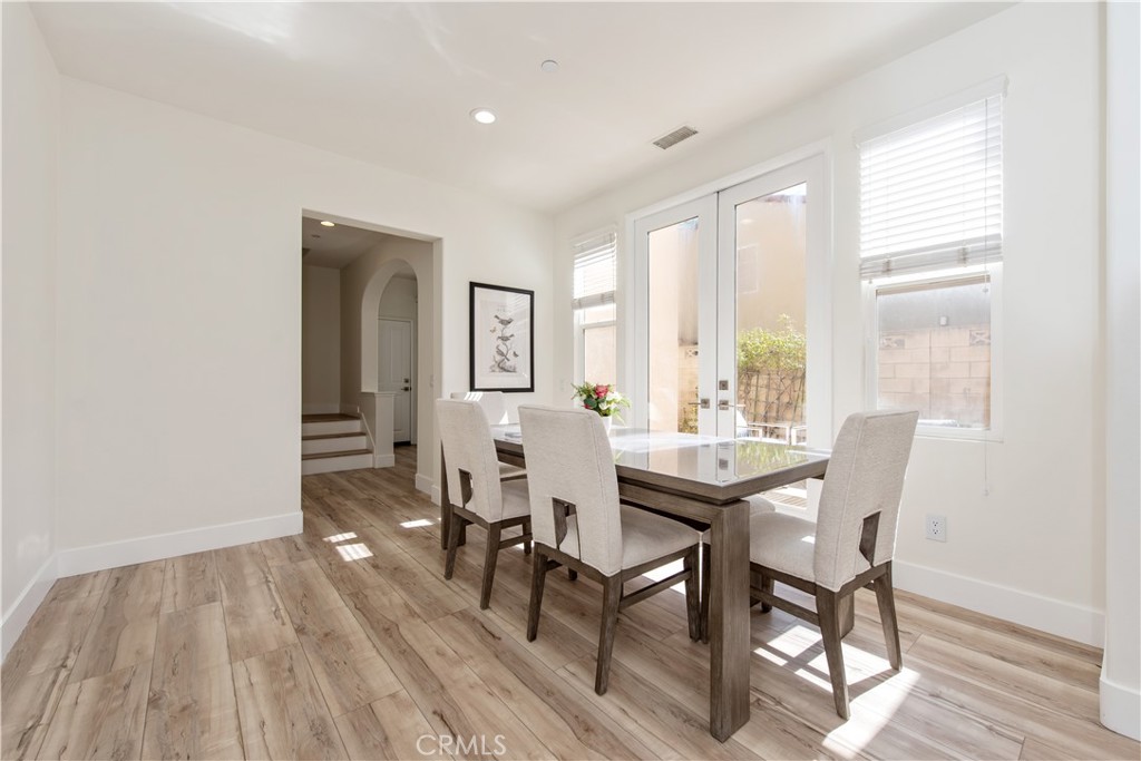 94 Chantilly Irvine, CA 92620 - Photo 7 of 30 a view of a dining room with furniture and wooden floor