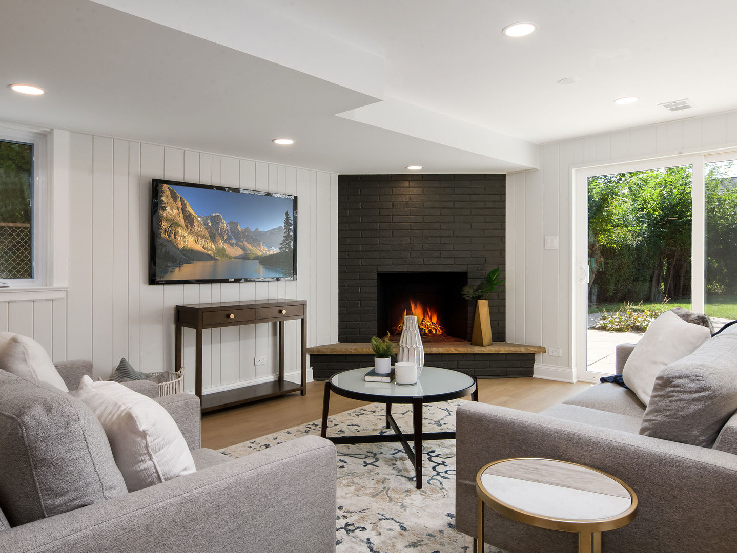 4343 Davis Street Skokie, IL 60076 - Photo 11 of 41 a living room with furniture and a fireplace