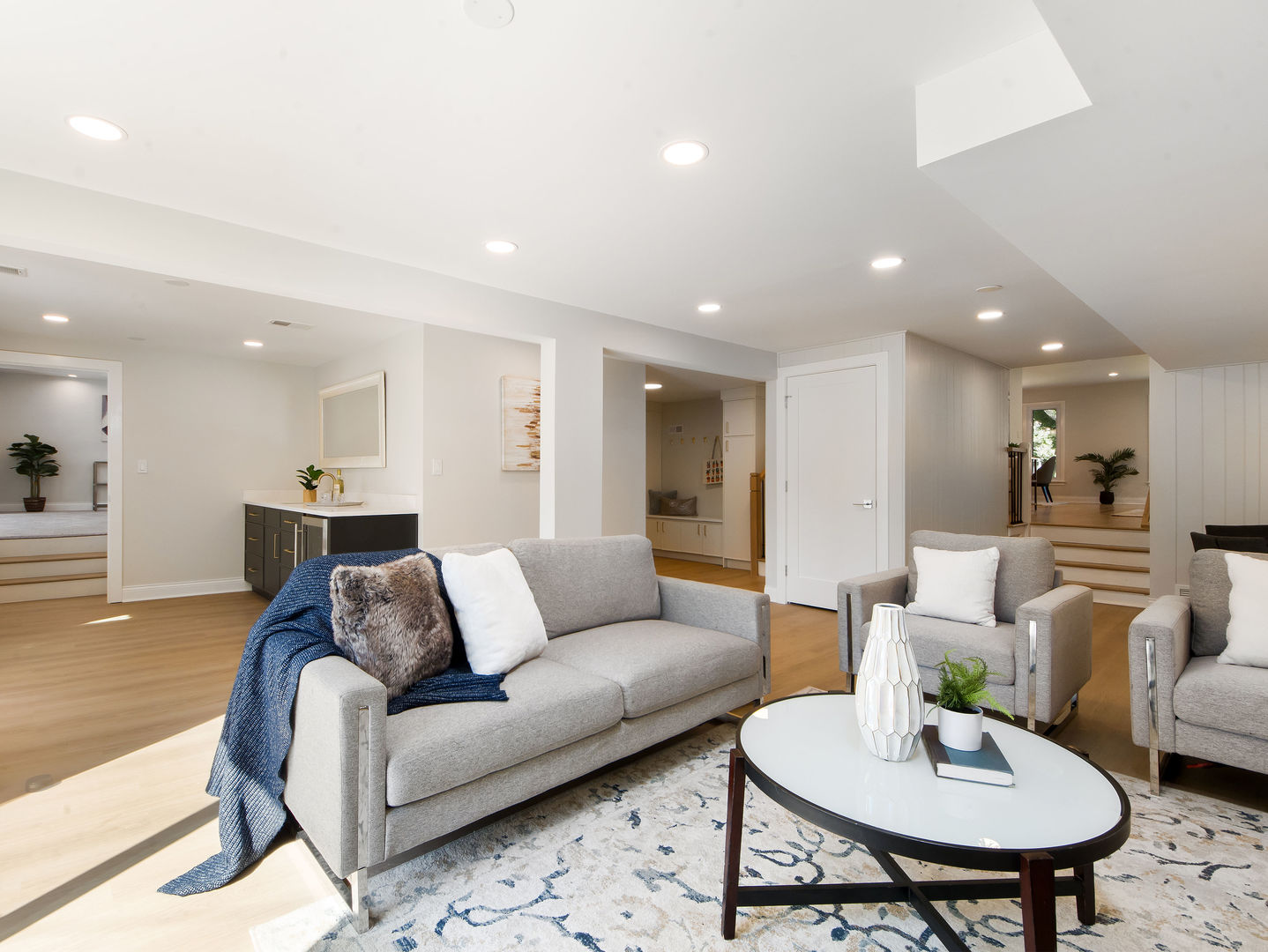 4343 Davis Street Skokie, IL 60076 - Photo 12 of 41 a living room with furniture and a dining table with wooden floor