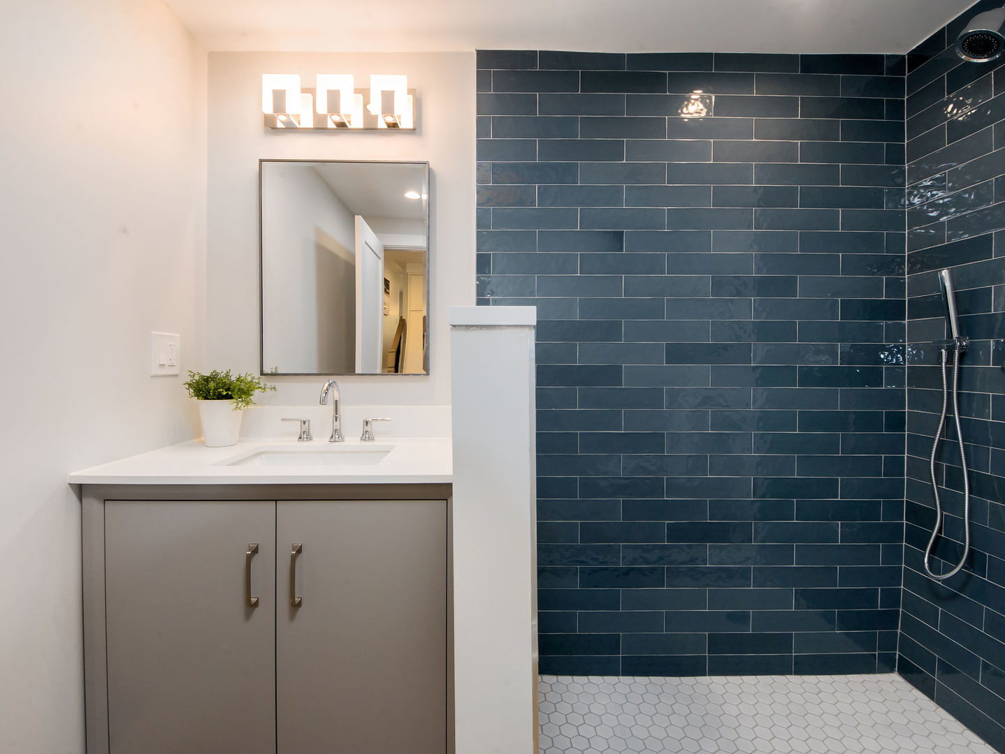 4343 Davis Street Skokie, IL 60076 - Photo 27 of 41 a bathroom with a sink a mirror and shower
