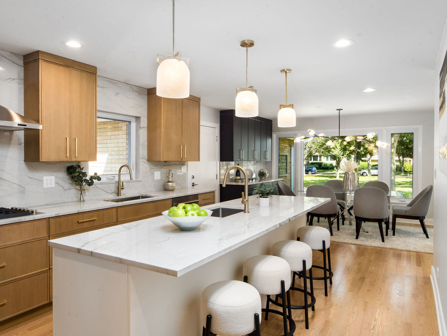 4343 Davis Street Skokie, IL 60076 - Photo 6 of 41 a kitchen with a table chairs and a living room