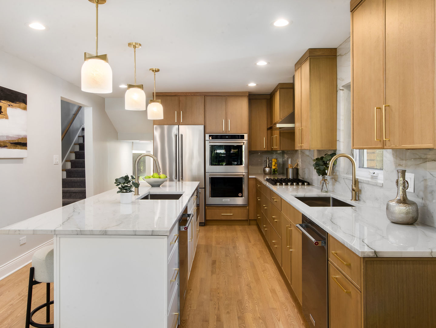 4343 Davis Street Skokie, IL 60076 - Photo 7 of 41 a open kitchen with stainless steel appliances granite countertop a sink a stove and a refrigerator