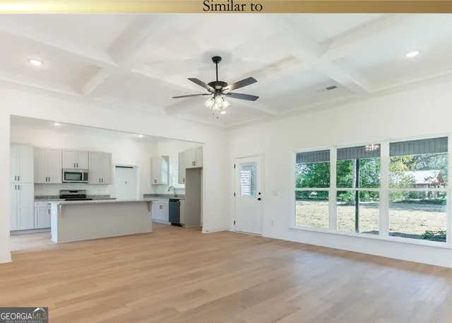 a view of a kitchen with a sink and a stove