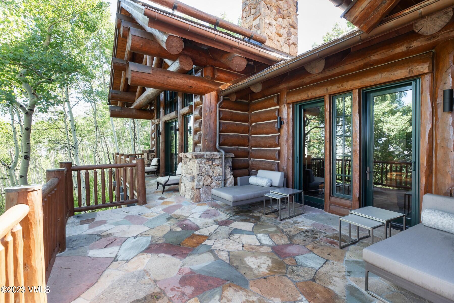 941 Daybreak Ridge Road Avon, CO 81620 - Photo 16 of 29 a view of a chairs and table in the patio