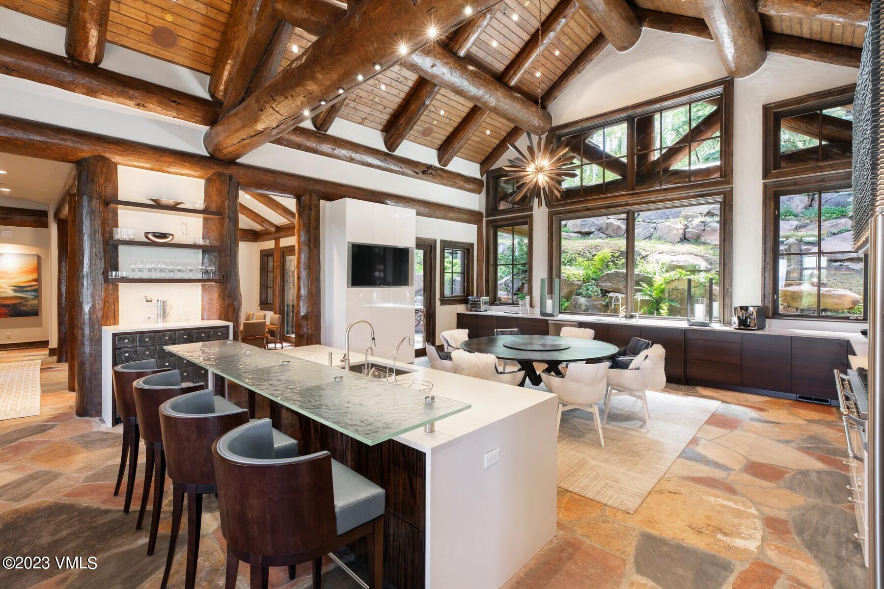 941 Daybreak Ridge Road Avon, CO 81620 - Photo 2 of 29 a view of a dining room with furniture window and outside view