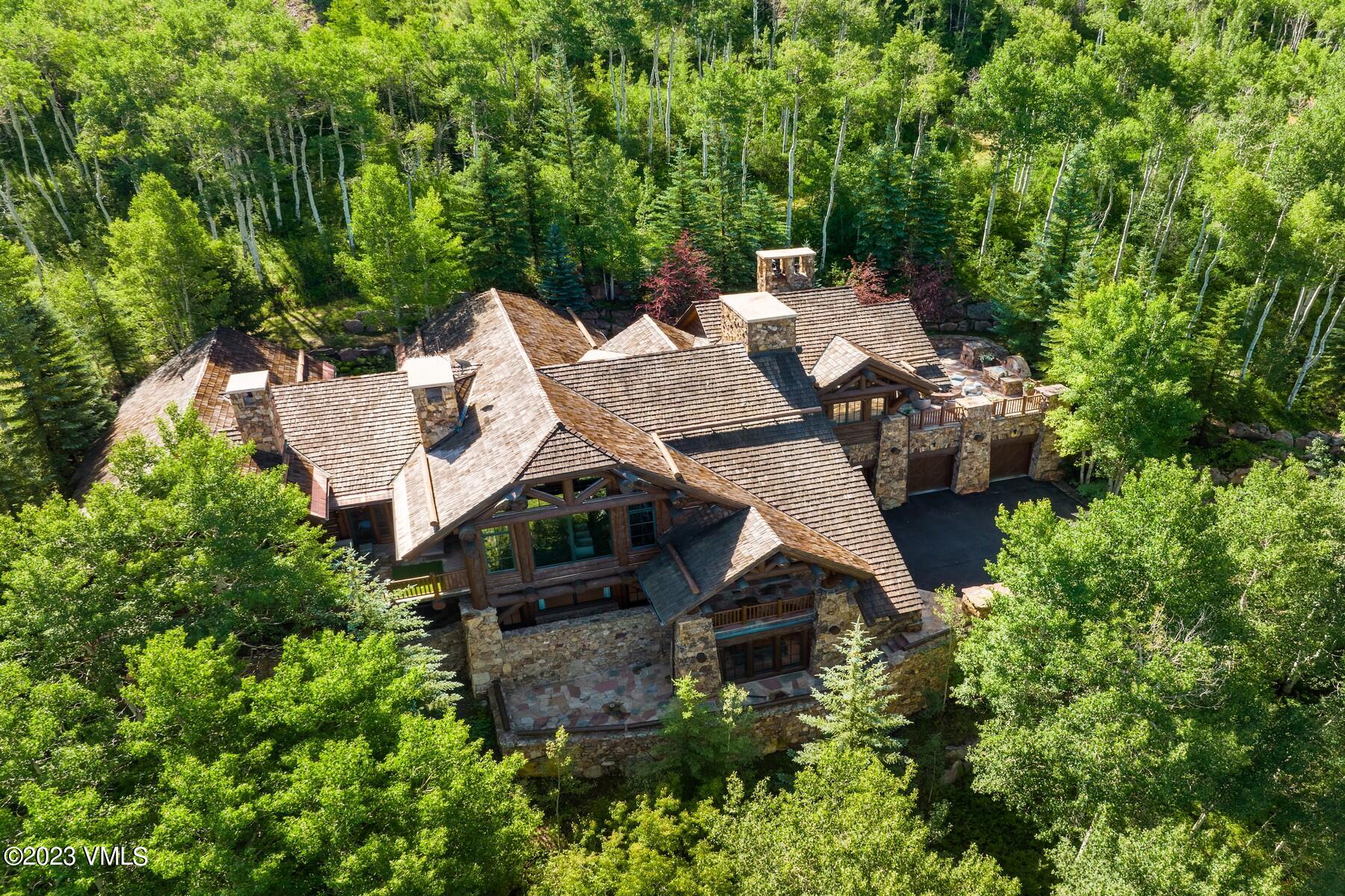 941 Daybreak Ridge Road Avon, CO 81620 - Photo 29 of 29 an aerial view of a house with outdoor space and trees all around