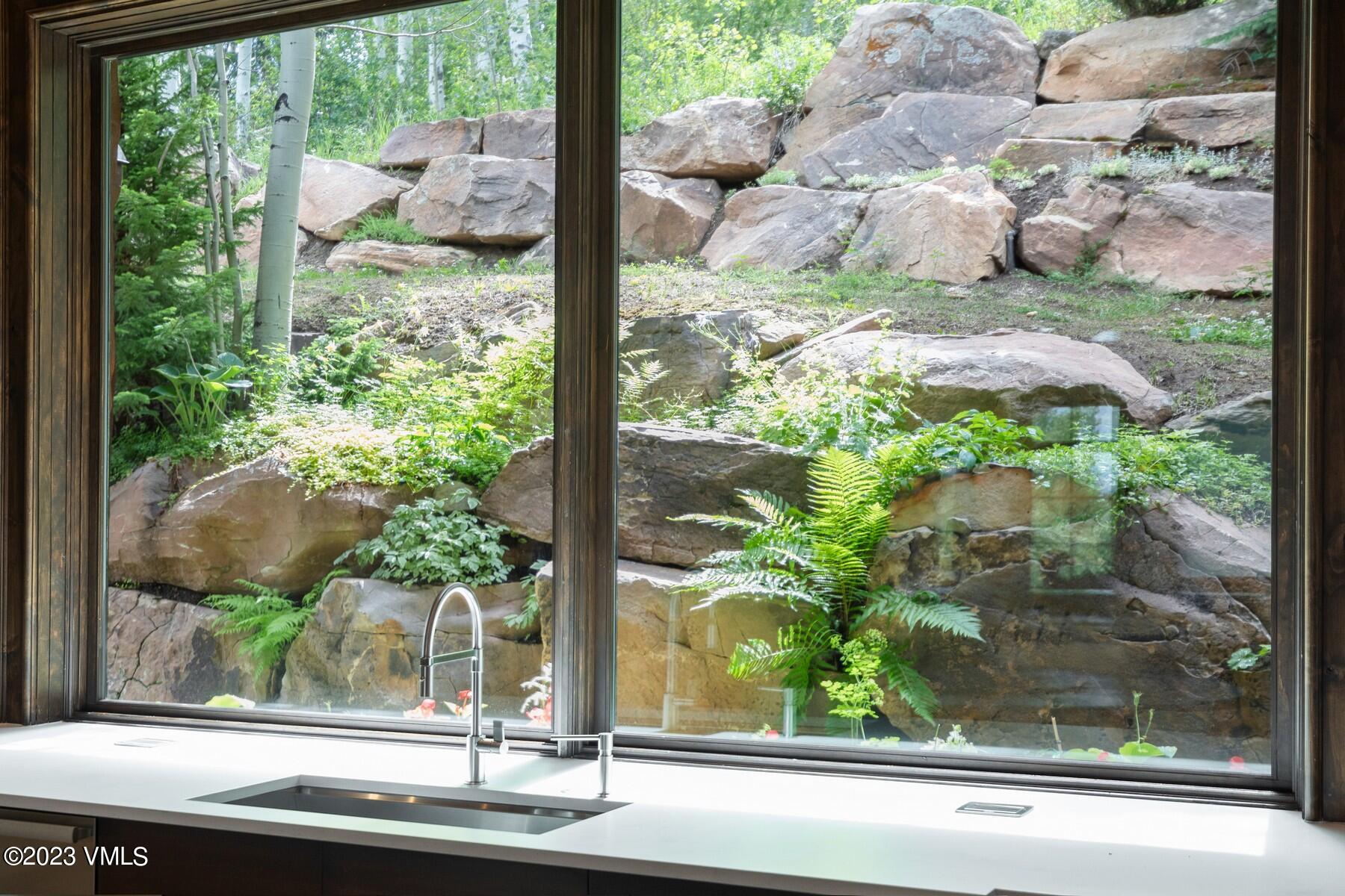 941 Daybreak Ridge Road Avon, CO 81620 - Photo 4 of 29 a view of a window with a tree in front of it