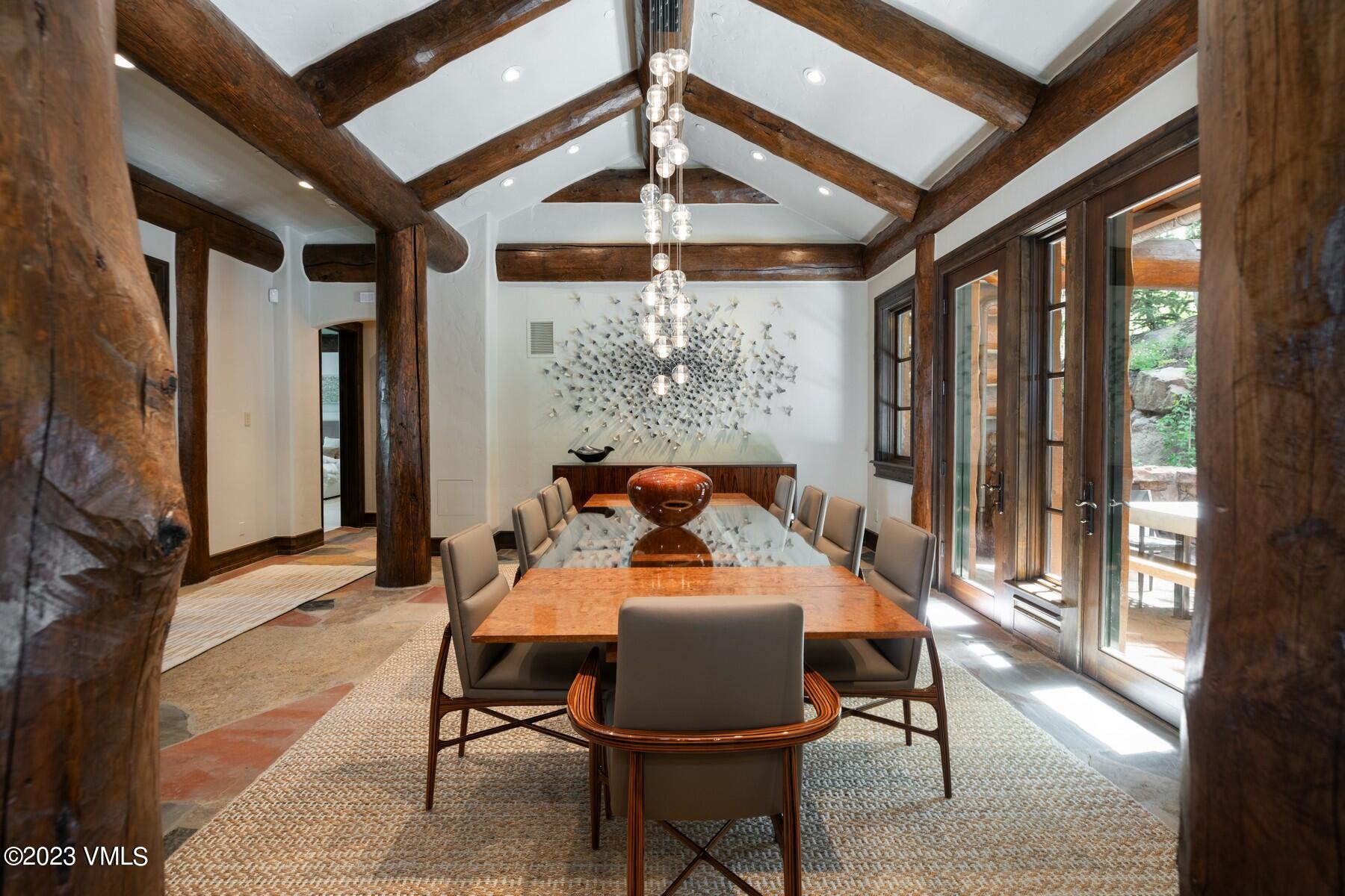 941 Daybreak Ridge Road Avon, CO 81620 - Photo 6 of 29 a dining room with furniture and a floor to ceiling window