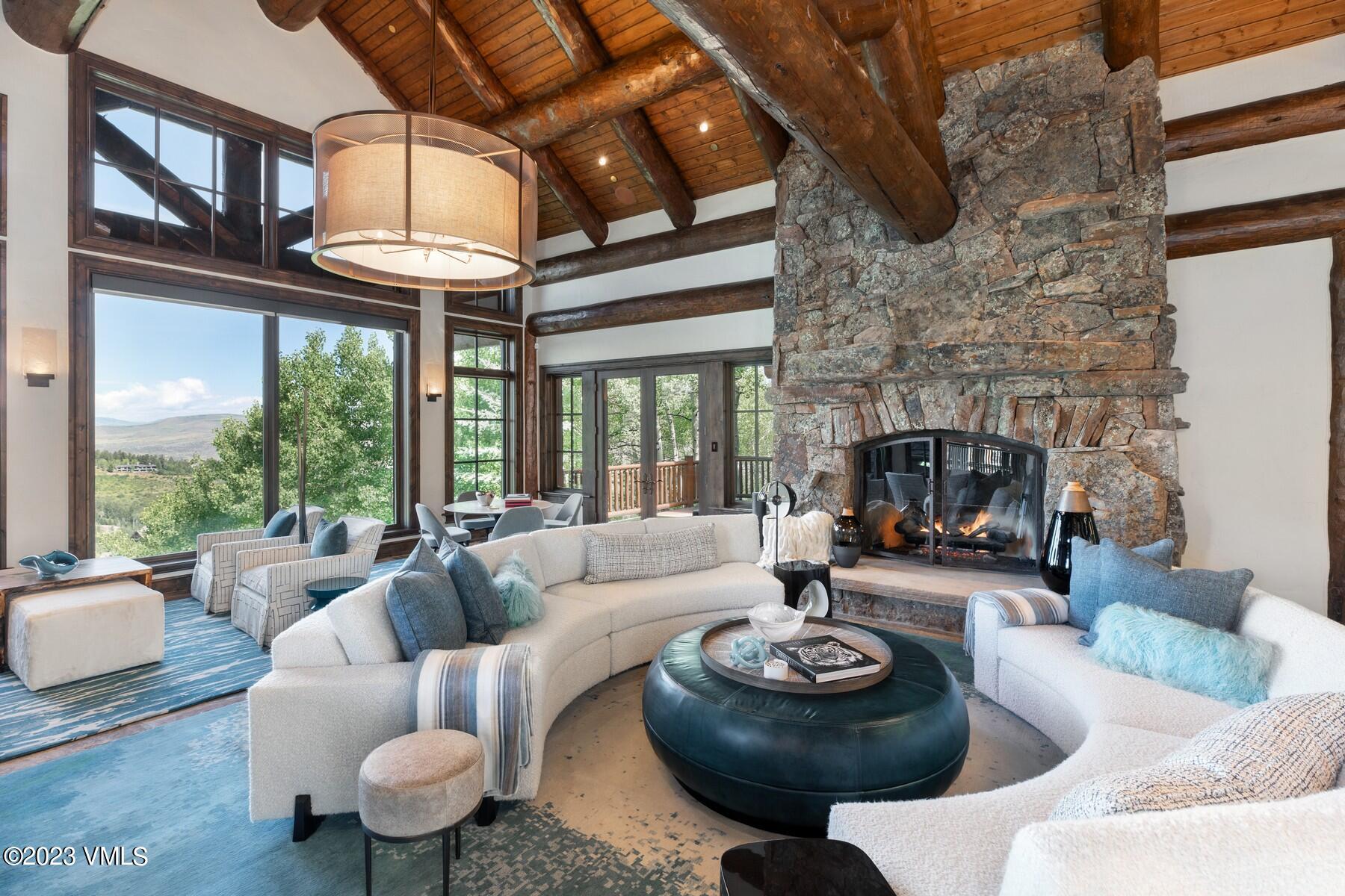 941 Daybreak Ridge Road Avon, CO 81620 - Photo 8 of 29 a living room with furniture and a fireplace