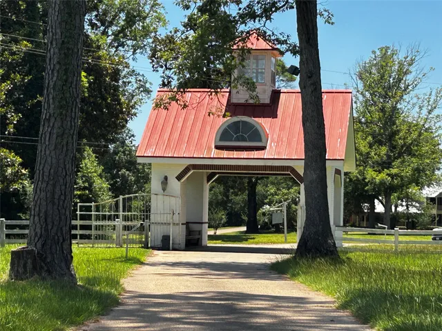 a view of swimming pool with a garden and trees