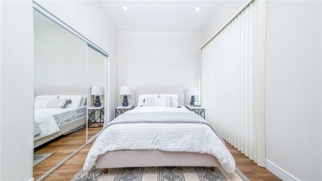 a spacious bedroom with a bed and a couch