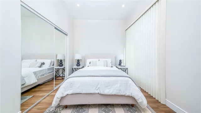 a spacious bedroom with a bed and a couch