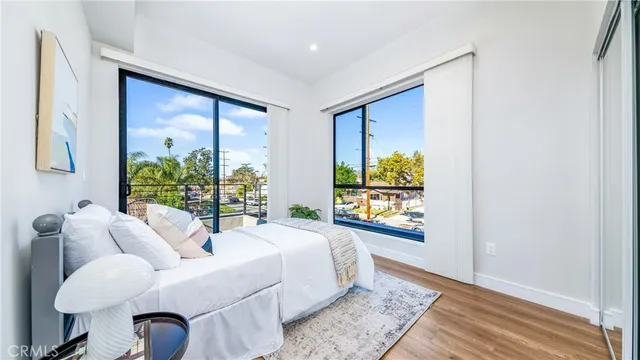 a bedroom with furniture and a window
