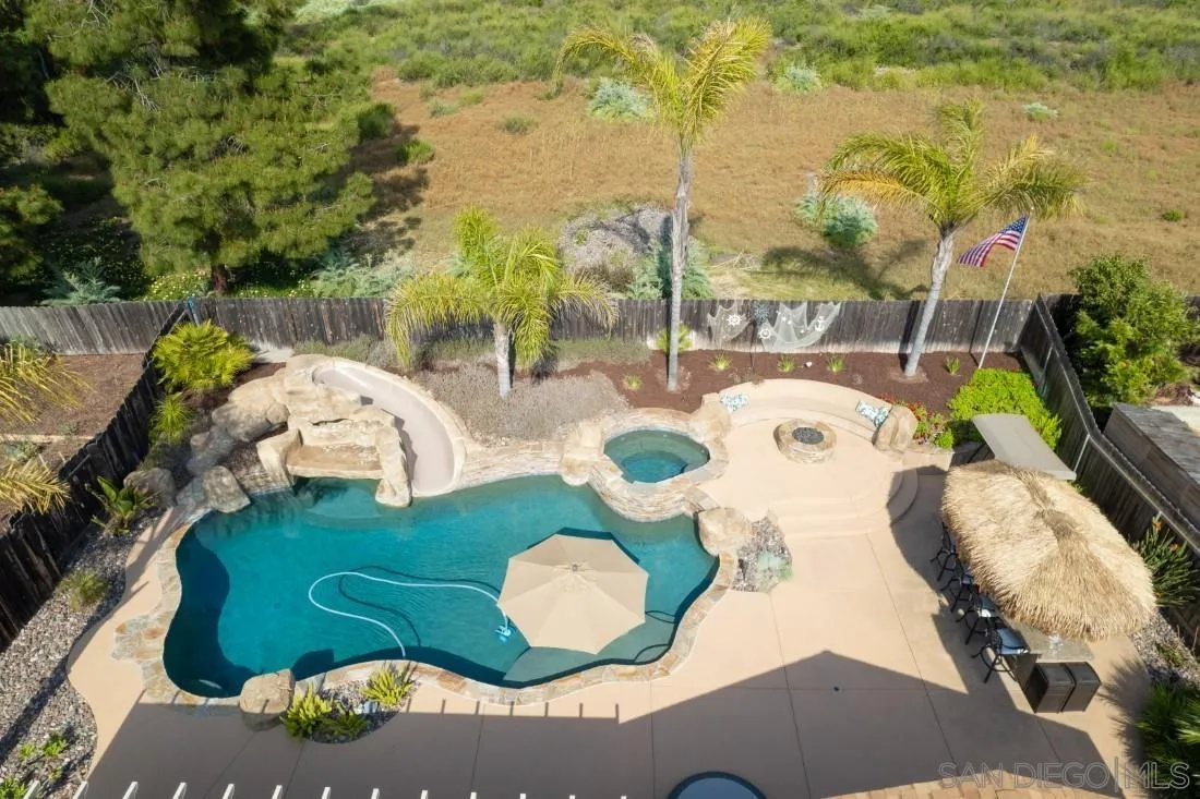 13829 Tobiasson Road Poway, CA 92064 - Photo 11 of 52 a view of a swimming pool and outdoor space