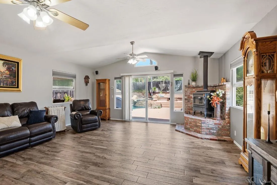 13829 Tobiasson Road Poway, CA 92064 - Photo 12 of 52 a living room with furniture and a large window