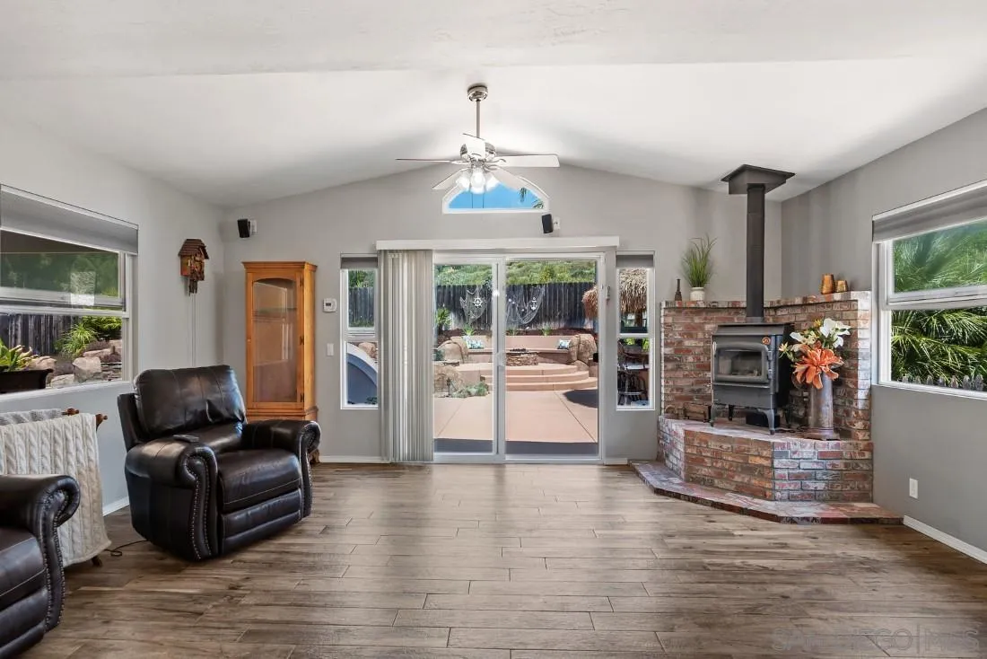 13829 Tobiasson Road Poway, CA 92064 - Photo 13 of 52 a living room with furniture and a flat screen tv
