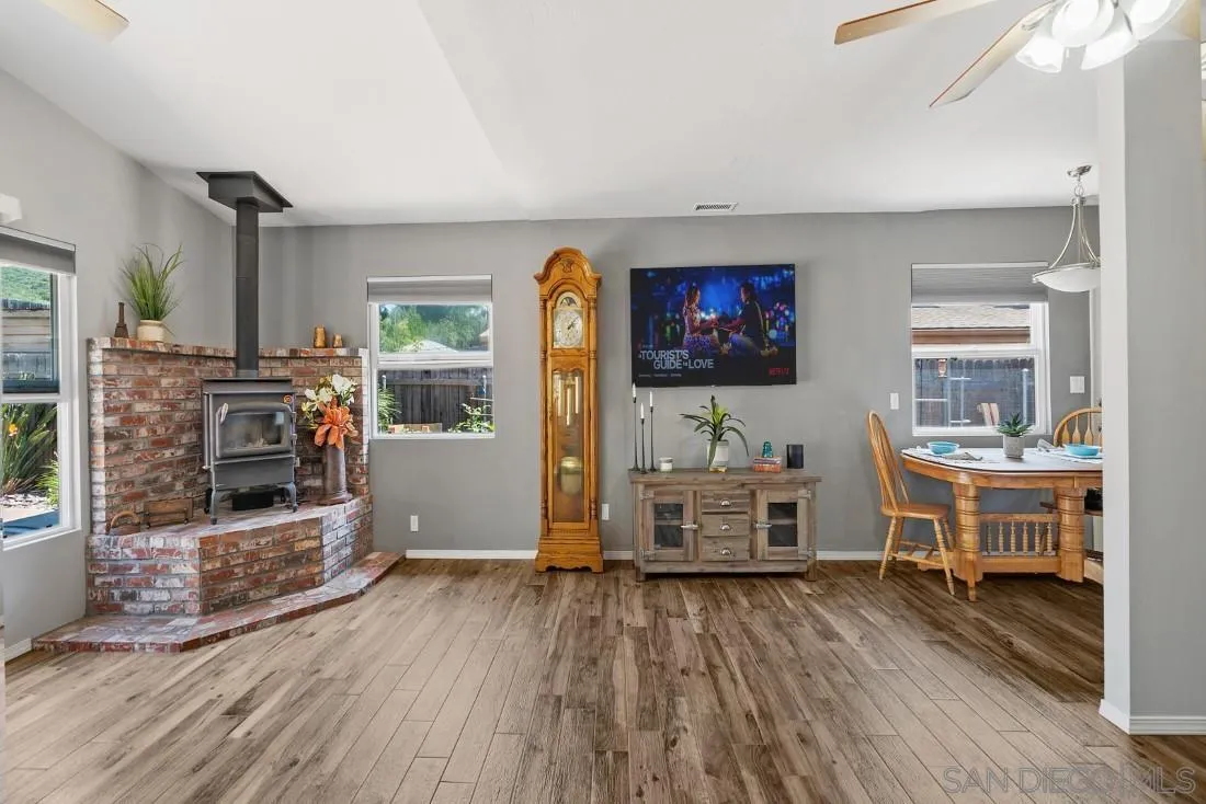 13829 Tobiasson Road Poway, CA 92064 - Photo 14 of 52 a living room with furniture and a flat screen tv