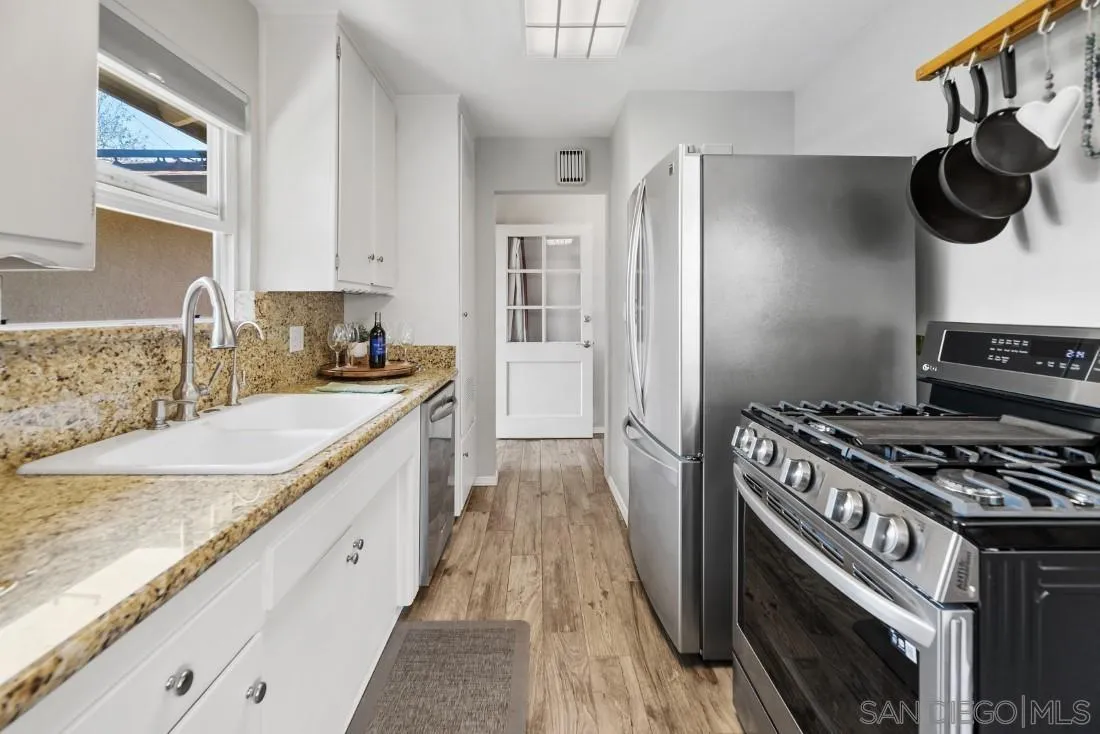 13829 Tobiasson Road Poway, CA 92064 - Photo 19 of 52 a kitchen with a stove and a sink