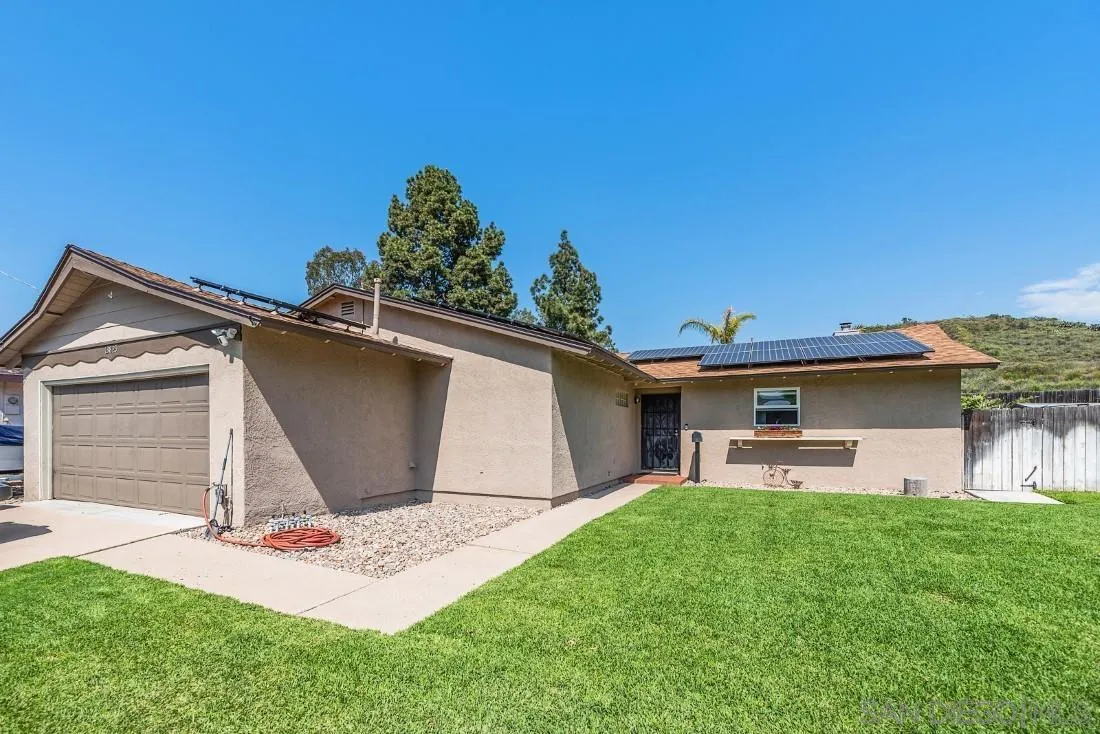 13829 Tobiasson Road Poway, CA 92064 - Photo 2 of 52 a front view of a house with a yard and garage