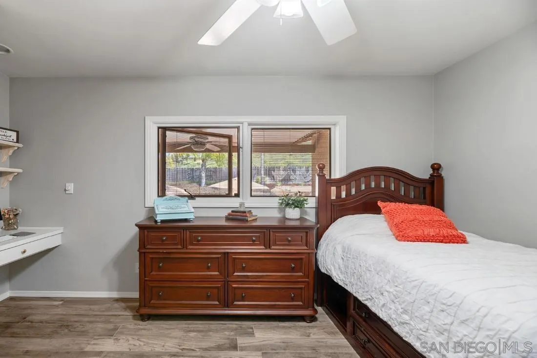 13829 Tobiasson Road Poway, CA 92064 - Photo 24 of 52 a bedroom with a bed and a window