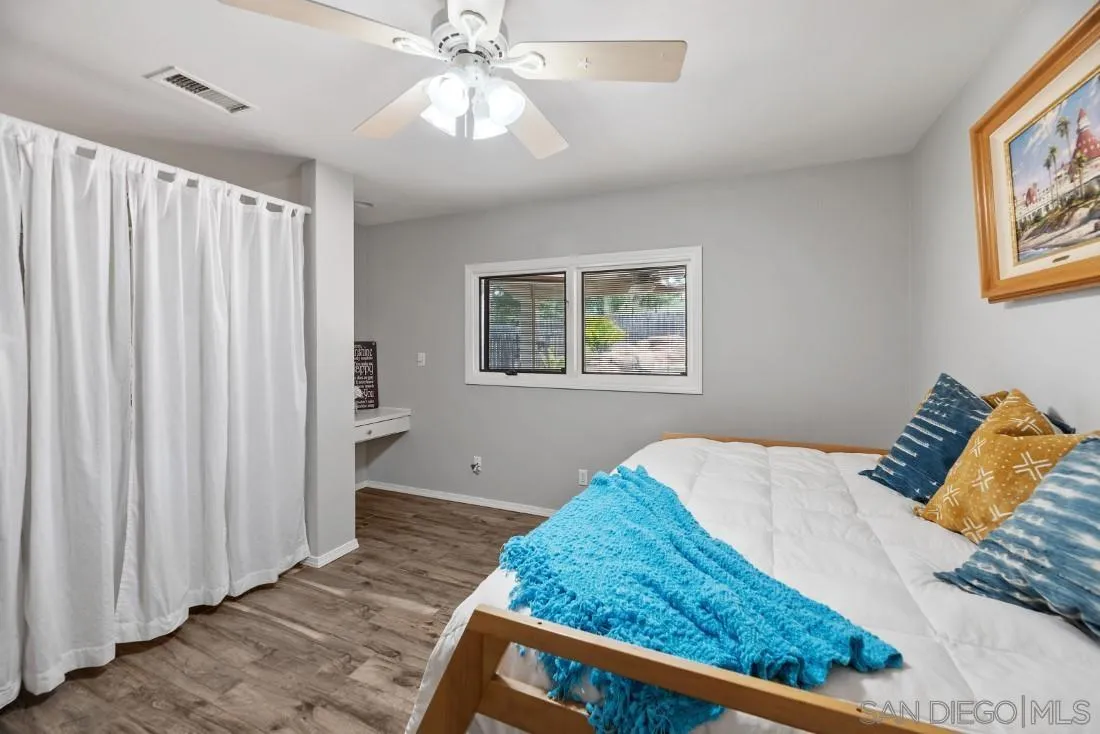 13829 Tobiasson Road Poway, CA 92064 - Photo 25 of 52 a bedroom with a bed and a window