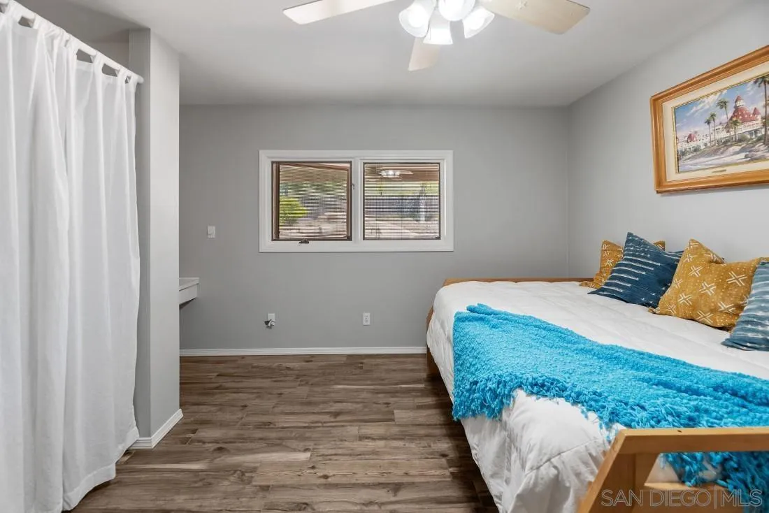 13829 Tobiasson Road Poway, CA 92064 - Photo 26 of 52 a bedroom with a bed and a window