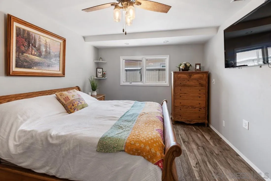13829 Tobiasson Road Poway, CA 92064 - Photo 29 of 52 a bedroom with a bed and a flat screen tv