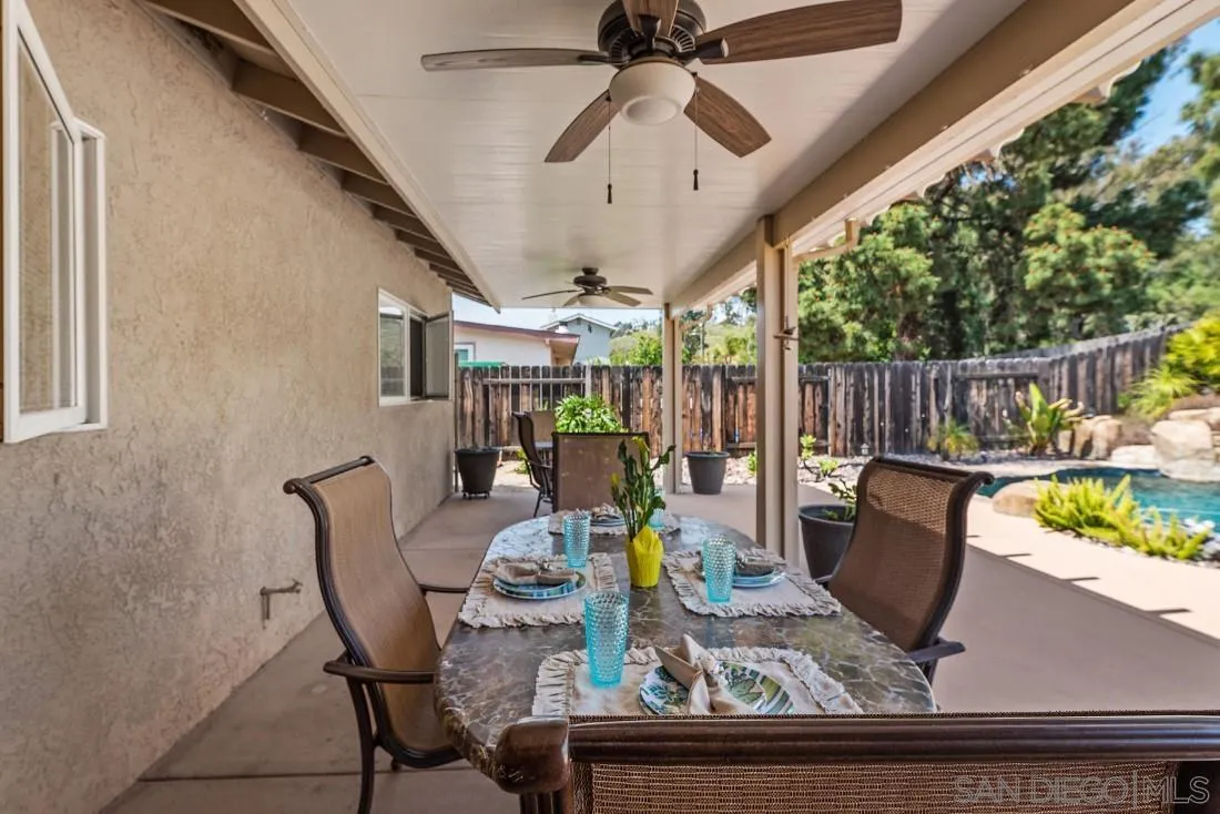 13829 Tobiasson Road Poway, CA 92064 - Photo 31 of 52 a view of a dining tables and chairs in the patio