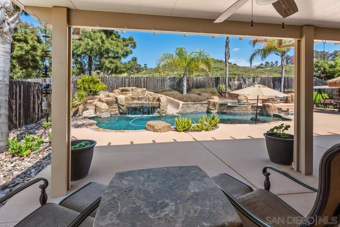 13829 Tobiasson Road Poway, CA 92064 - Photo 36 of 52 a view of a porch with chairs and a yard