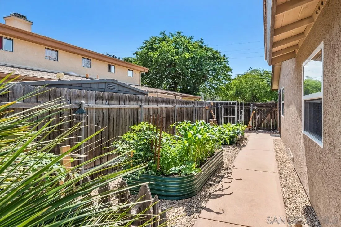 13829 Tobiasson Road Poway, CA 92064 - Photo 42 of 52 a front view of a house with a garden
