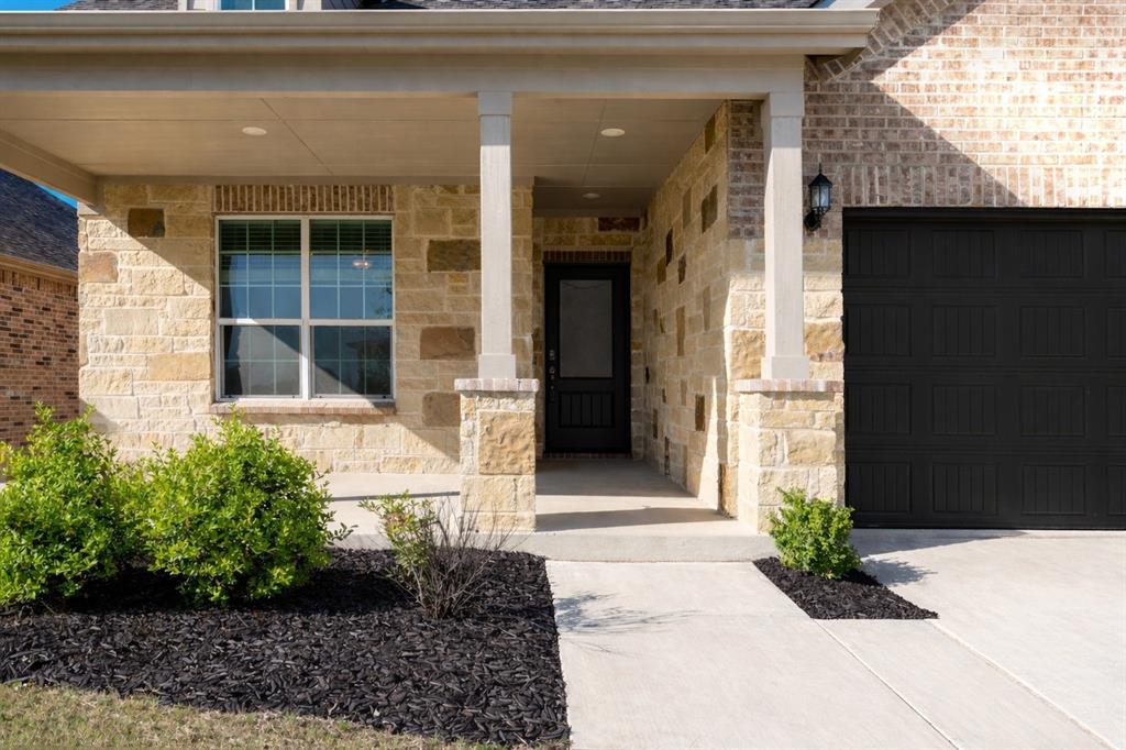 2020 Robert Street Anna, TX 75409 - Photo 2 of 16 a front view of a house with garden