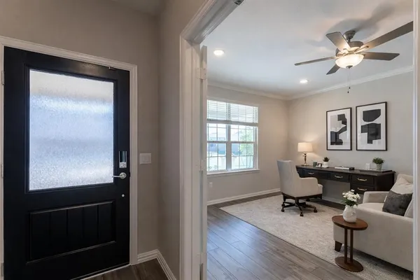 a living room with furniture and a window