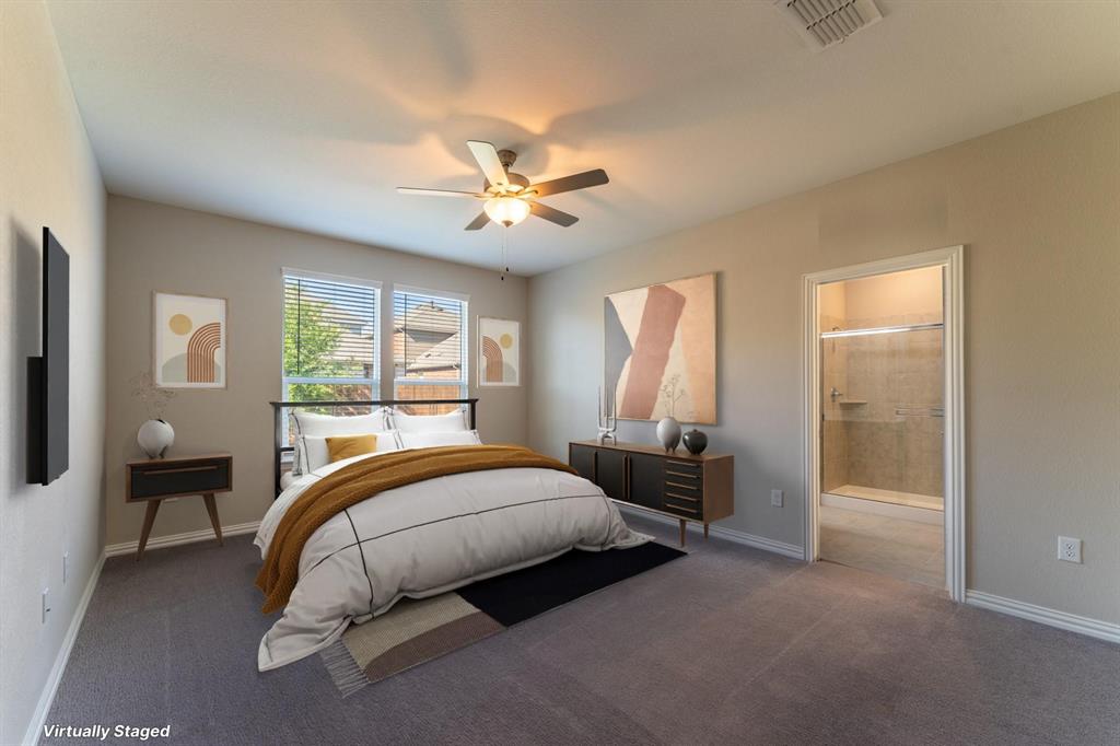 2020 Robert Street Anna, TX 75409 - Photo 9 of 16 a spacious bedroom with a bed a chandelier and a window