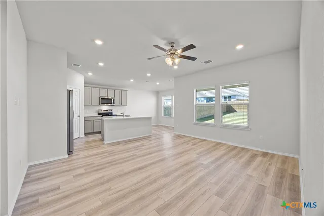 a view of kitchen with wooden floor and window