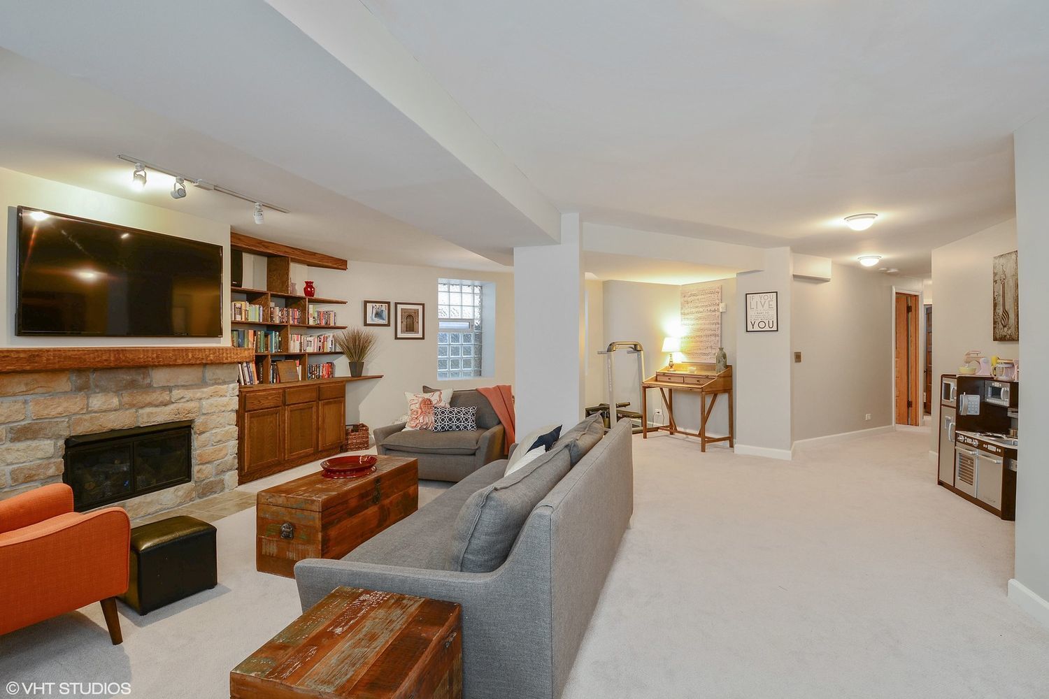 2608 North Dayton Street, Unit 1S Chicago, IL 60614 - Photo 13 of 17 a living room with furniture a fireplace and a flat screen tv