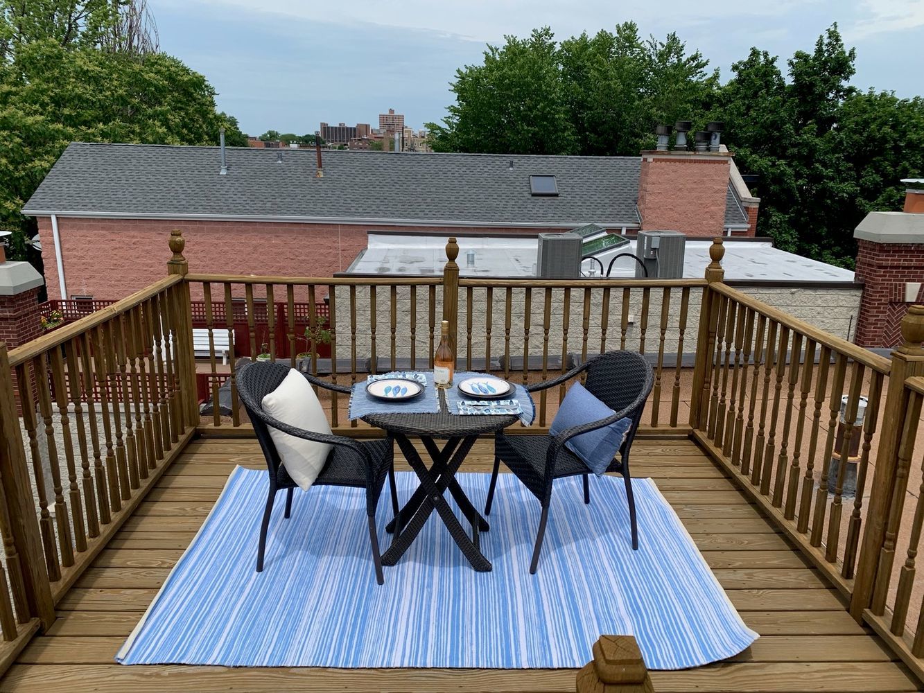 2608 North Dayton Street, Unit 1S Chicago, IL 60614 - Photo 17 of 17 a view of deck with table and chairs a barbeque with wooden floor and fence