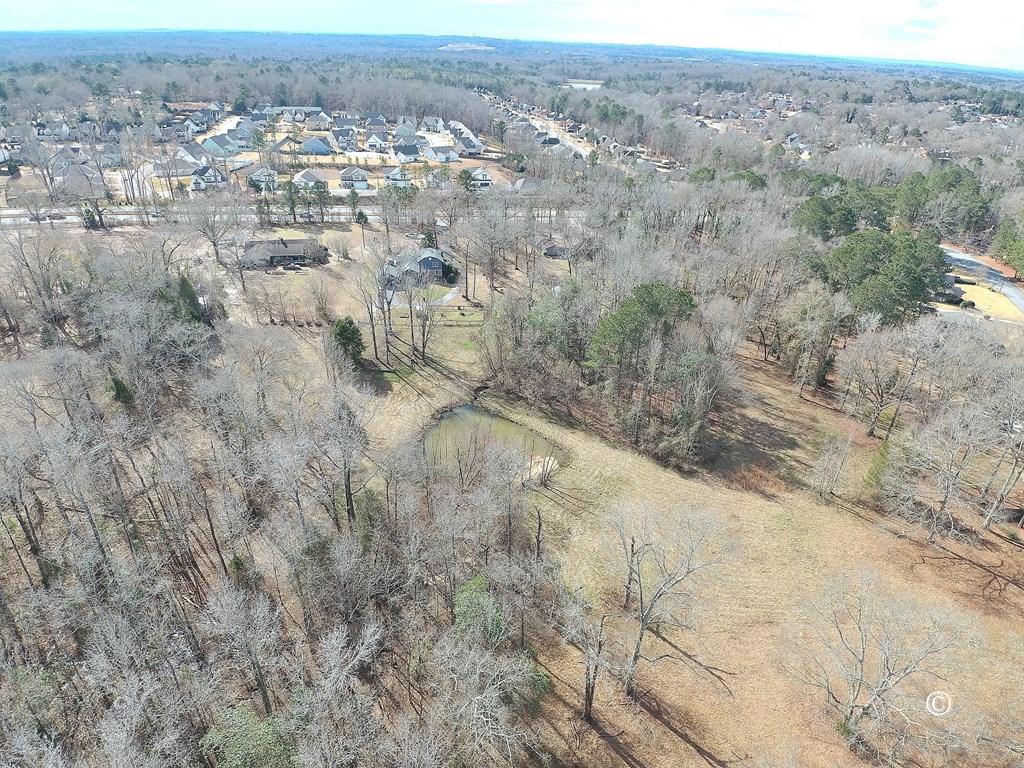 7593 Beaver Run Road Columbus, GA 31820 - Photo 5 of 8 an aerial view of residential houses with outdoor space and trees