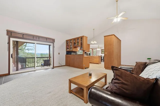 a bed room with furniture and a large window