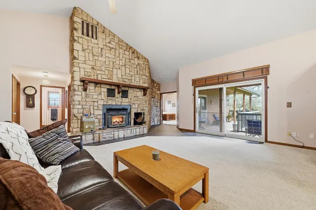 a living room with furniture and a ceiling fan