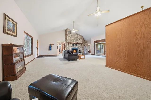 a kitchen with stainless steel appliances granite countertop a stove a sink dishwasher and microwave oven with cabinets