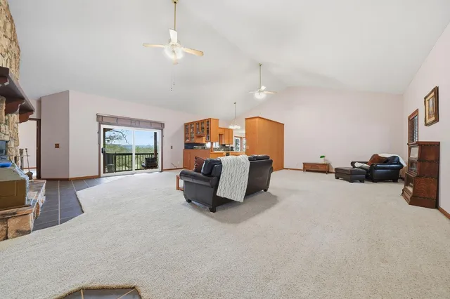 a spacious bedroom with a bed and a chandelier