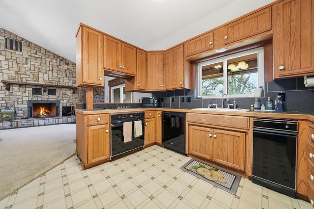 a bathroom with a tub sink and mirror