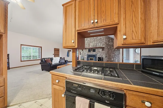 a bathroom with a sink and mirror with toilet