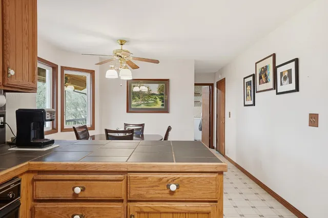 an aerial view of a house with garden space and street view