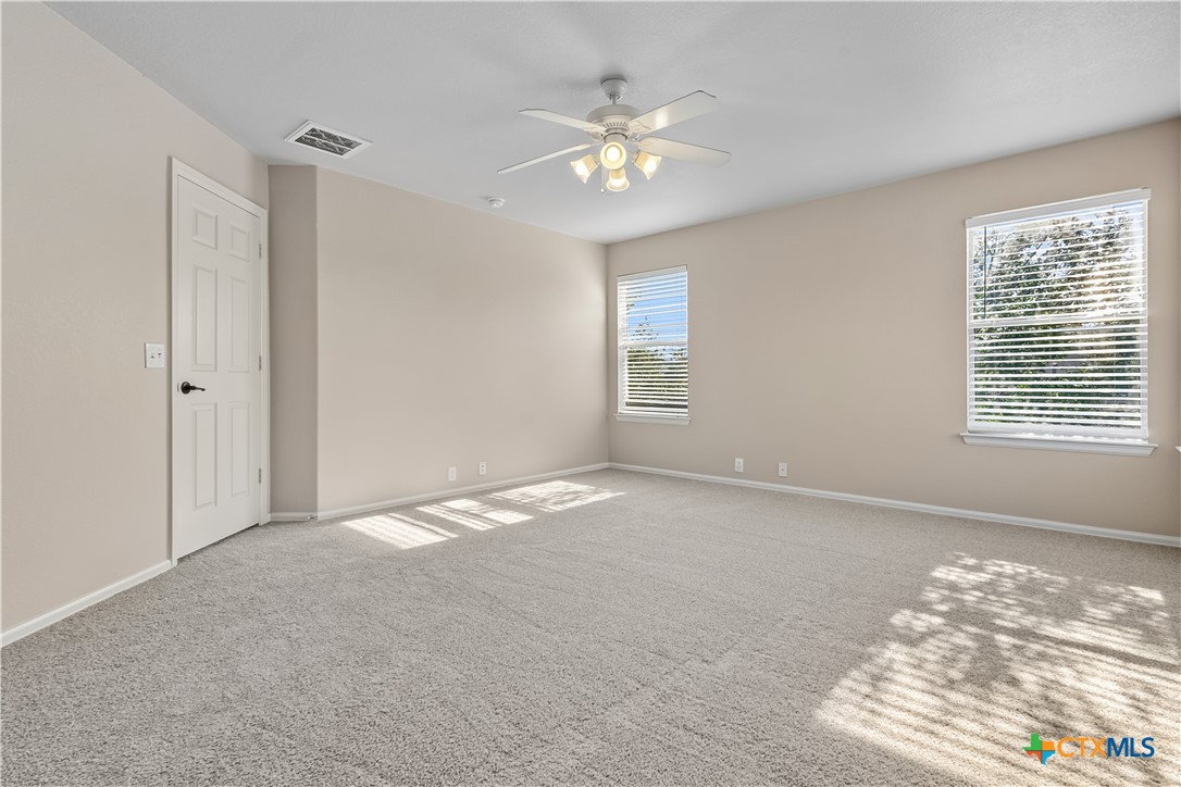172 Coreopsis Cove Kyle, TX 78640 - Photo 2 of 33 a view of an empty room with a window